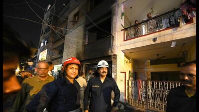 Fire fighters outside the building in which the fire broke out in Mukherjee Nagar on Wednesday. (Raj K Raj/HT PHOTO) Fire fighters outside the building in which the fire broke out in Mukherjee Nagar on Wednesday. (Raj K Raj/HT PHOTO)