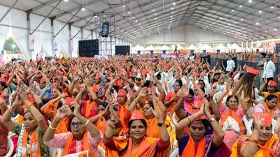 Bharatiya Janata Party (BJP) supporters cheer as they welcome PM Modi during a BJP gathering of women to address the recently passed women's reservation bill in Ahmedabad. (AFP)