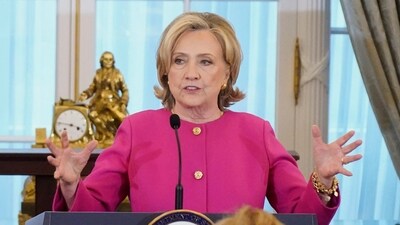Former US Secretary of State Hillary Clinton delivers remarks during the unveiling of her portrait, at the State Department in Washington, US. (Reuters)