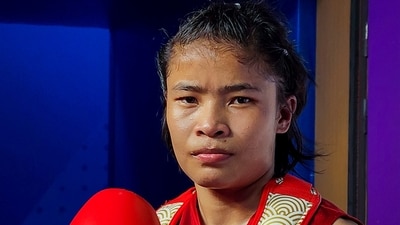 India's Naorem Roshibina Devi poses after defeating Vietnam's Thi Thu Thuy Nguyen in Women's 60 kg Wushu semifinal at the 19th Asian Games (PTI) India's Naorem Roshibina Devi poses after defeating Vietnam's Thi Thu Thuy Nguyen in Women's 60 kg Wushu semifinal at the 19th Asian Games (PTI)