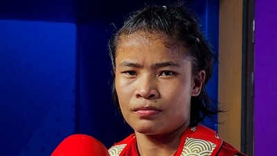 India's Naorem Roshibina Devi poses after defeating Vietnam's Thi Thu Thuy Nguyen in Women's 60 kg Wushu semifinal at the 19th Asian Games, in Hangzhou (PTI)