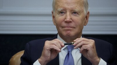 US President Joe Biden looks on. (Reuters)