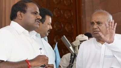 JD(S) leader and former prime minister HD Deve Gowda (right) with his son HD Kumaraswamy (left). (PTI) JD(S) leader and former prime minister HD Deve Gowda (right) with his son HD Kumaraswamy (left). (PTI)
