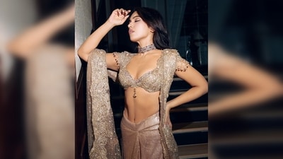 In her ensemble, Bhumi Pednekar embraces modern elements, including a bralette blouse, a low-waist pleated skirt, and a dupatta. (Instagram/@bhumipednekar) In her ensemble, Bhumi Pednekar embraces modern elements, including a bralette blouse, a low-waist pleated skirt, and a dupatta. (Instagram/@bhumipednekar)