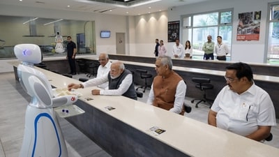 Prime Minister Narendra Modi, who is on a visit to Gujarat, enjoyed a cup of tea served by robots at the Robotics Gallery in the state. (Twitter/@narendramodi) Prime Minister Narendra Modi, who is on a visit to Gujarat, enjoyed a cup of tea served by robots at the Robotics Gallery in the state. (Twitter/@narendramodi)
