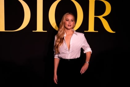 Jennifer Lawrence poses before Christian Dior Spring/Summer 2024 womenswear collection presented Tuesday in Paris. (AP)