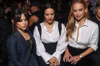 Jenna Ortega, Rosalia, and Jennifer Lawrence pose for pictures. (Vianney Le Caer/Invision/AP)