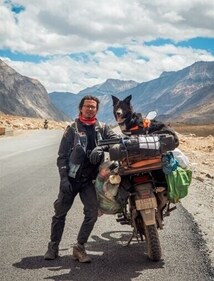 Bella with her pet parent on their way to the mountains
