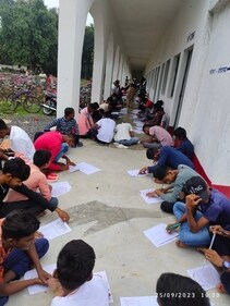 Students seen writing exam on floor (Photosourced ) Students seen writing exam on floor (Photosourced )