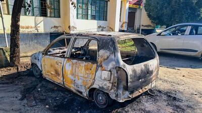 A vehicle that was set on fire by protesters over the killing of two Meitei students (PTI) A vehicle that was set on fire by protesters over the killing of two Meitei students (PTI)
