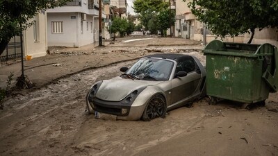 This photograph taken on September 28, 2023 shows a car on a muddy street after the Storm Elias at Volos. Hundreds of people were rescued from floods in Greece overnight (AFP) This photograph taken on September 28, 2023 shows a car on a muddy street after the Storm Elias at Volos. Hundreds of people were rescued from floods in Greece overnight (AFP)