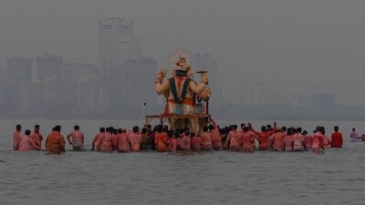 The Lord Ganesh idols were carried out of pandals for their final journey into the Arabian Sea and other bodies of water as devotees gathered along the procession routes to witness the event. (AP) The Lord Ganesh idols were carried out of pandals for their final journey into the Arabian Sea and other bodies of water as devotees gathered along the procession routes to witness the event. (AP)