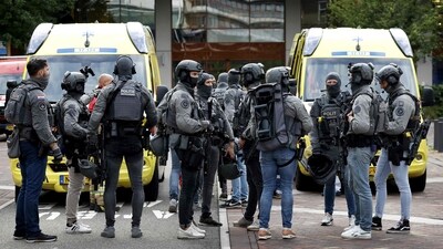 Netherlands' special intervention police officers gather at the Erasmus University Medical Center (Erasmus MC) in Rotterdam on September 28, 2023, which was cordoned off after two reported shooting incidents. Three people were injured in two separate shootings in Rotterdam, according to Dutch police and local media, with the gunman arrested after holing up in a hospital. (AFP) Netherlands' special intervention police officers gather at the Erasmus University Medical Center (Erasmus MC) in Rotterdam on September 28, 2023, which was cordoned off after two reported shooting incidents. Three people were injured in two separate shootings in Rotterdam, according to Dutch police and local media, with the gunman arrested after holing up in a hospital. (AFP)