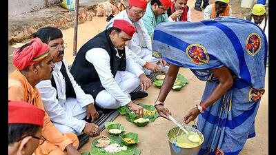 Samajwadi Party president Akhilesh Yadav eats a meal with an Adiwasi family, in Rajnagar of Madhya Pradesh, Thursday. (PTI Photo) Samajwadi Party president Akhilesh Yadav eats a meal with an Adiwasi family, in Rajnagar of Madhya Pradesh, Thursday. (PTI Photo)