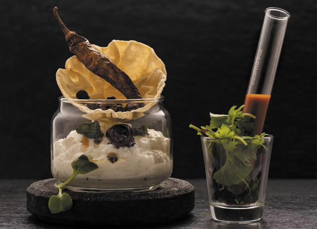 Cuttle fish with black garlic, coconut and cauliflower at Avartana. Cuttle fish with black garlic, coconut and cauliflower at Avartana.