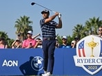 US golfer, Xander Schauffele watches his shot from the 10th tee during his foursomes match on the first day of play in the 44th Ryder Cup at the Marco Simone Golf and Country Club in Rome on September 29, 2023. (Photo by Alberto PIZZOLI / AFP)