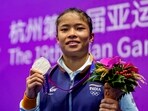 Hangzhou: India's Naorem Roshibina Devi with her silver medal poses for photographs during presentation ceremony Hangzhou: India's Naorem Roshibina Devi with her silver medal poses for photographs during presentation ceremony