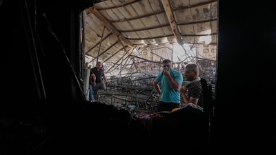 People gather at the site of a fatal fire, in the district of Hamdaniya, Nineveh province, Iraq. (AP) People gather at the site of a fatal fire, in the district of Hamdaniya, Nineveh province, Iraq. (AP)