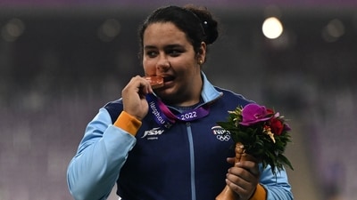 Bronze medallist India's Kiran Baliyan celebrates on the podium during the medal ceremony for the women's shot put final athletics event during the 2022 Asian Games (AFP) Bronze medallist India's Kiran Baliyan celebrates on the podium during the medal ceremony for the women's shot put final athletics event during the 2022 Asian Games (AFP)