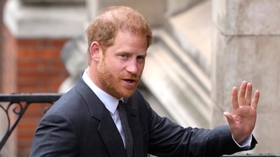 FILE - Britain's Prince Harry salutes media as he arrives at the Royal Courts of Justice in London, on March 30, 2023. Prince Harry is attending a charity event in London, though he isn’t expected to meet with King Charles III or Prince William as Britain prepares to mark the first anniversary of Queen Elizabeth II’s death. Harry’s relationship with his family has been strained since he and his wife, Meghan, moved to California in 2020. (AP) FILE - Britain's Prince Harry salutes media as he arrives at the Royal Courts of Justice in London, on March 30, 2023. Prince Harry is attending a charity event in London, though he isn’t expected to meet with King Charles III or Prince William as Britain prepares to mark the first anniversary of Queen Elizabeth II’s death. Harry’s relationship with his family has been strained since he and his wife, Meghan, moved to California in 2020. (AP)