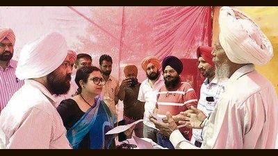 Deputy commissioner Surabhi Malik listening to the problems of the people at a revenue camp in Ludhiana on Friday (Manish/HT)