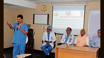 Dr Bishav Mohan addressing the media on the occasion of World Heart Day at DMCH Hospital, Ludhiana, on Friday (Manish/HT)