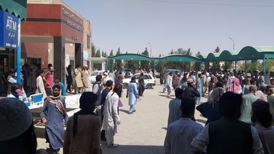 People gather outside the Mastung hospital, following a deadly suicide attack on a religious gathering in Balochistan province, Pakistan, September 29, 2023 in this handout image. (via Reuters)