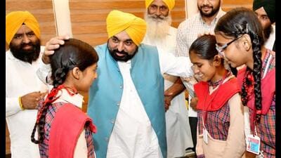 Punjab CM Bhagwant Mann interacts with students after dedicating libraries to people, at Ghanauri Kalan village in Dhuri assembly constituency on Friday. Punjab CM Bhagwant Mann interacts with students after dedicating libraries to people, at Ghanauri Kalan village in Dhuri assembly constituency on Friday.