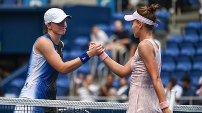 Iga Swiatek of Poland (L) shakes hands with winner Veronika Kudermetova of Russia (R) after their women's singles quarter-final (AFP) Iga Swiatek of Poland (L) shakes hands with winner Veronika Kudermetova of Russia (R) after their women's singles quarter-final (AFP)