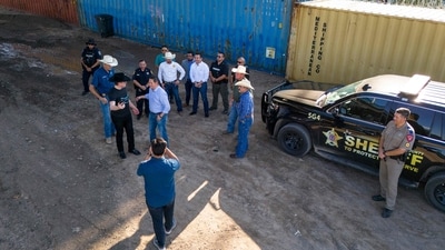 Tech entrepreneur Elon Musk, wearing a black Stetson hat, speaking with Rep Tony Gonzales (R-TX) while visiting the Texas-Mexico border (Getty Images via AFP) Tech entrepreneur Elon Musk, wearing a black Stetson hat, speaking with Rep Tony Gonzales (R-TX) while visiting the Texas-Mexico border (Getty Images via AFP)