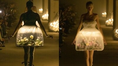 Models in lamp dresses walking the ramp at Paris Fashion Week. (Instagram/@undercover_lab)