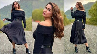 Hina Khan is a total stunner who can pull off any look to perfection. Whether it's a sartorial saree or a chic pantsuit, the actress knows how to slay fashion goals like a pro. Hina is quite active on social media and her Insta-diaries, filled with stylish looks, proved to be a treasure trove of fashion inspiration for all her followers. Her latest look in a black skirt and stylish sweatshirt is no exception and is sure to inspire your winter wardrobe. (Instagram/@realhinakhan) Hina Khan is a total stunner who can pull off any look to perfection. Whether it's a sartorial saree or a chic pantsuit, the actress knows how to slay fashion goals like a pro. Hina is quite active on social media and her Insta-diaries, filled with stylish looks, proved to be a treasure trove of fashion inspiration for all her followers. Her latest look in a black skirt and stylish sweatshirt is no exception and is sure to inspire your winter wardrobe. (Instagram/@realhinakhan)