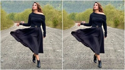 In terms of accessories, she styled her look with a black belt, silver bangles that adorned her wrist and a pair of shiny black boots. (Instagram/@realhinakhan) In terms of accessories, she styled her look with a black belt, silver bangles that adorned her wrist and a pair of shiny black boots. (Instagram/@realhinakhan)