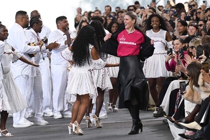 Designer Gabriela Hearst (CR) gestures at the end of the Chloe fashion show during the Paris Fashion Week Womenswear Spring/Summer 2024, in Paris on September 28, 2023. (Photo by Bertrand GUAY / AFP) Designer Gabriela Hearst (CR) gestures at the end of the Chloe fashion show during the Paris Fashion Week Womenswear Spring/Summer 2024, in Paris on September 28, 2023. (Photo by Bertrand GUAY / AFP)