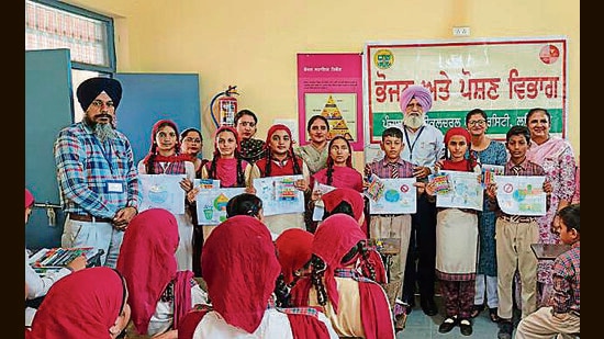 As many as 150 school students participated in poster-making competition and quiz organised on the occasion. (HT Photo)