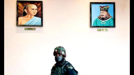 Portraits of Kautilya, also known as Chanakya, and Chinese strategist Sun Tzu inside the border personnel meeting hut at the Line of Actual Control in Bum La in Arunachal Pradesh. (HT File Photo/Rahul Singh)