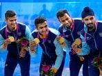 Gold medallists Saurav Ghosal, Abhay Singh, Mahesh Mangaonkar and Harinder Pal Sandhu pose for photos during the presentation ceremony of the Squash Men's Team event at the 19th Asian Games(PTI)