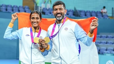 Rohan Bopanna and Rutuja Sampatrao Bhosale pose for photos with their gold medals after beating Chinese Taipei's Liang En-shuo and Tsung-Hao Huang during the Mixed Doubles Final match at the Asian Games (ANI) Rohan Bopanna and Rutuja Sampatrao Bhosale pose for photos with their gold medals after beating Chinese Taipei's Liang En-shuo and Tsung-Hao Huang during the Mixed Doubles Final match at the Asian Games (ANI)