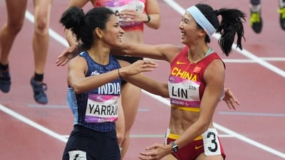 China's Lin Yuwei, who finished first, is congratulated by India's Jyothi Yarraji, who finished second, during the women's 100-meter hurdle heat 1 at the 19th Asian Games (AP) China's Lin Yuwei, who finished first, is congratulated by India's Jyothi Yarraji, who finished second, during the women's 100-meter hurdle heat 1 at the 19th Asian Games (AP)