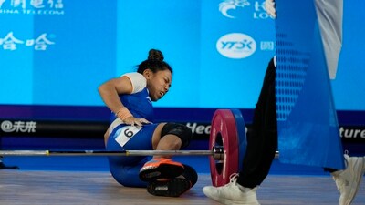 India's Mirabai Chanu Saikhom reacts in pain after she got injured while competing in the women's 49kg Group A weightlifting final at 19th Asian Games in Hangzhou (AP) India's Mirabai Chanu Saikhom reacts in pain after she got injured while competing in the women's 49kg Group A weightlifting final at 19th Asian Games in Hangzhou (AP)