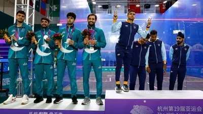 Gold medallists from team India react next to silver medallists from team Pakistan during the medal ceremony (REUTERS)