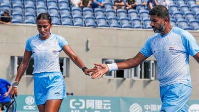 India's Rohan Bopanna and Rutuja Sampatrao Bhosale during the mixed doubles semifinal tennis match against Chinese Taipei's Yu-Hsiou Hsu and Hao-ching Chan at the 19th Asian Games, in Hangzhou, China (PTI) India's Rohan Bopanna and Rutuja Sampatrao Bhosale during the mixed doubles semifinal tennis match against Chinese Taipei's Yu-Hsiou Hsu and Hao-ching Chan at the 19th Asian Games, in Hangzhou, China (PTI)