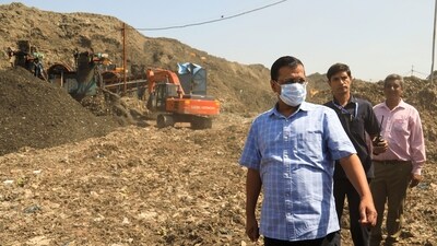 Delhi Chief Minister Arvind Kejriwal with others visits the Bhalswa landfill site, in New Delhi on Saturday. (PTI) Delhi Chief Minister Arvind Kejriwal with others visits the Bhalswa landfill site, in New Delhi on Saturday. (PTI)