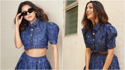 Shehnaaz wore the top with a coordinated mini skirt featuring structured pleats, a mini hem length, a high-rise waistline, and a flared silhouette. The tie-dye pattern done in light and darker shades on the ensemble added a stylish detail to her outfit. (Instagram) Shehnaaz wore the top with a coordinated mini skirt featuring structured pleats, a mini hem length, a high-rise waistline, and a flared silhouette. The tie-dye pattern done in light and darker shades on the ensemble added a stylish detail to her outfit. (Instagram)