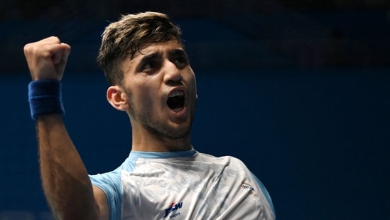 India's Lakshya Sen reacts after beating South Korea's Lee Yung-yu in their men's badminton team semi-final match during the Hangzhou 2022 Asian Games in Hangzhou in China's eastern Zhejiang province (AFP)