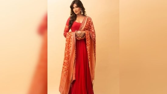 Chitrangda Singh wore a floor-length red anarkali suit, elegantly matched with an intricately designed dupatta.&nbsp;(Instagram/@chitrangda)
