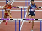 China's Yuwei Lin and India's Jyothi Yarraji in action during the women's 100m hurdles final