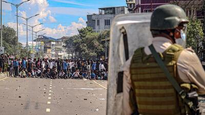 A security official stands guard as student protest against the killing of two Meitei students. (PTI)