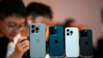 People look at the new iPhone 15 Pro as Apple's new iPhone 15 officially goes on sale across China at an Apple store in Shanghai (REUTERS)