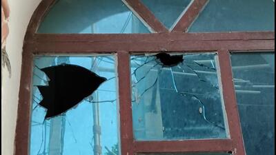 Bullet holes in a window of the house. (HT Photo) Bullet holes in a window of the house. (HT Photo)